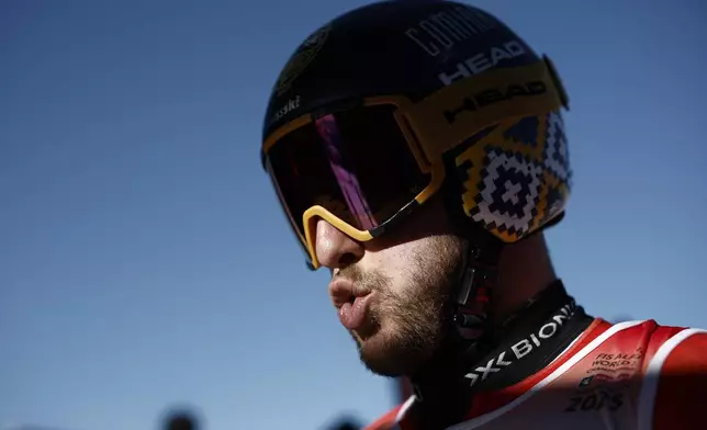 Switzerland's Justin Murisier concentrates ahead of a men's downhill training, at the Alpine Ski World Championships, in Saalbach-Hinterglemm, Austria, Wednesday, Feb. 5, 2025. (AP Photo/Gabriele Facciotti)