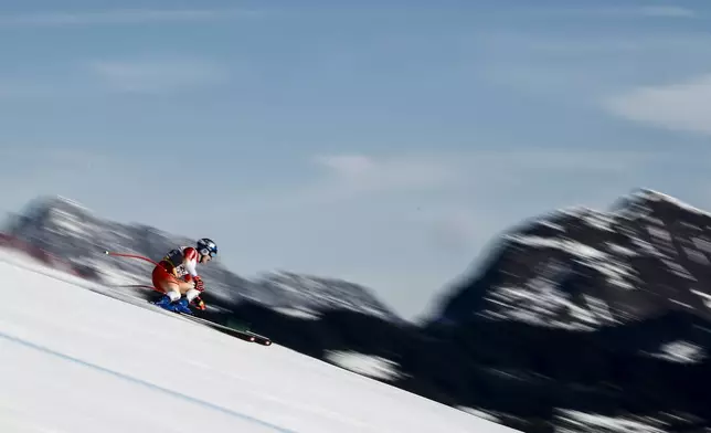 Switzerland's Marco Odermatt speeds down the course during a men's downhill training, at the Alpine Ski World Championships, in Saalbach-Hinterglemm, Austria, Thursday, Feb. 6, 2025. (AP Photo/Giovanni Auletta)