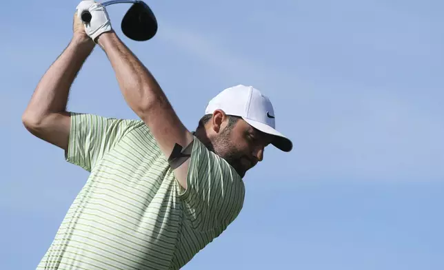 Scottie Scheffler hits his tee shot at the third hole during the third round of the Phoenix Open golf tournament at TPC Scottsdale, Saturday, Feb. 8, 2025, in Scottsdale, Ariz. (AP Photo/Ross D. Franklin)