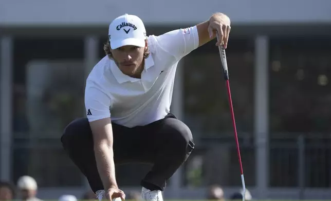 Rasmus Højgaard, of Denmark, lines up a putt at the second hole during the third round of the Phoenix Open golf tournament at TPC Scottsdale Saturday, Feb. 8, 2025, in Scottsdale, Ariz. (AP Photo/Ross D. Franklin)