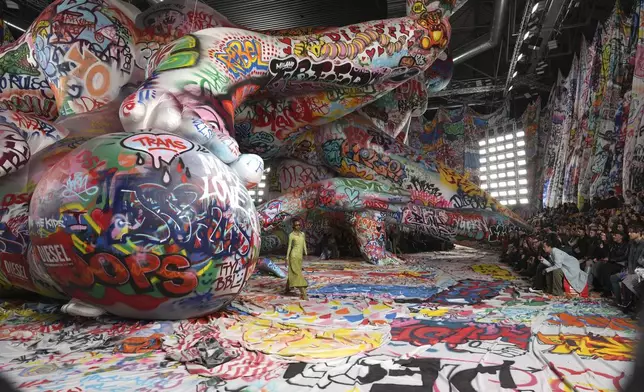 A model wears a creation of the Diesel Fall/Winter 2025-2026 women's collection presented in Milan, Italy, Wednesday, Feb. 26, 2025. (AP Photo/Antonio Calanni)