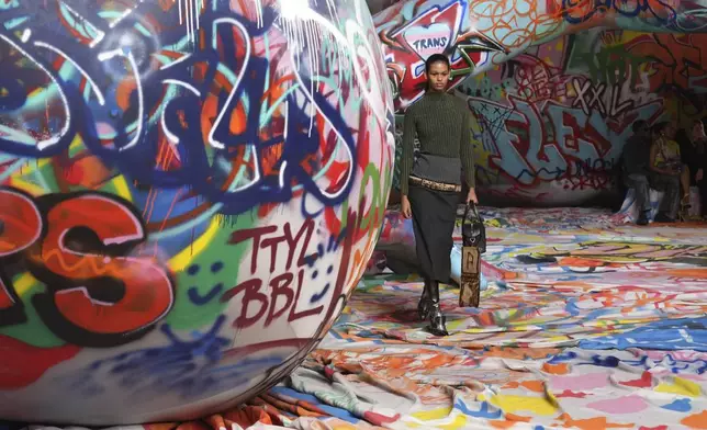 A model wears a creation of the Diesel Fall/Winter 2025-2026 women's collection presented in Milan, Italy, Wednesday, Feb. 26, 2025. (AP Photo/Antonio Calanni)