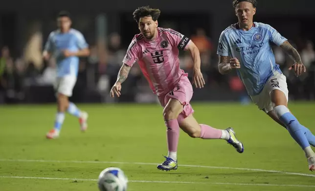 Inter Miami forward Lionel Messi, left, and New York City FC defender Birk Risa (5) vie for the ball during the first half of an MLS soccer match, Saturday, Feb. 22, 2025, in Fort Lauderdale, Fla. (AP Photo/Rebecca Blackwell)