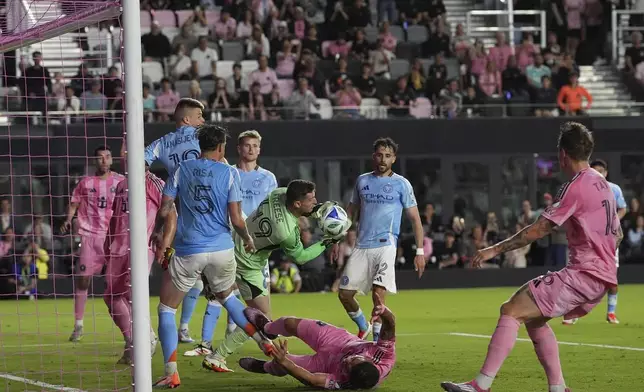 New York City FC goalkeeper Matt Freese (49) snags the ball as Inter Miami forward Luis Suarez hits the ground during the first half of an MLS soccer match, Saturday, Feb. 22, 2025, in Fort Lauderdale, Fla. (AP Photo/Rebecca Blackwell)