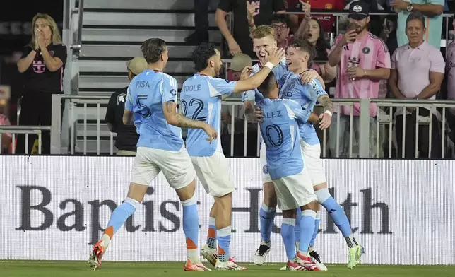 New York City FC players celebrate a goal by New York City FC defender Mitja Ilenic, right, during the first half of an MLS soccer match against Inter Miami, Saturday, Feb. 22, 2025, in Fort Lauderdale, Fla. (AP Photo/Rebecca Blackwell)
