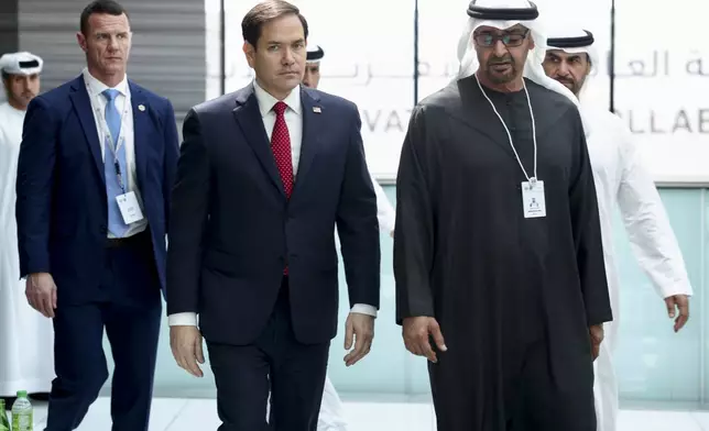 U.S. Secretary of State Marco Rubio, center, walks with United Arab Emirates President Sheikh Mohamed bin Zayed Al Nahyan as they meet at ADNEC Centre Abu Dhabi in Abu Dhabi, United Arab Emirates, Wednesday, Feb. 19, 2025. (Evelyn Hockstein/Pool Photo via AP)