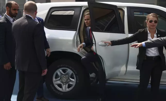 U.S. Secretary of State Marco Rubio gets out of a vehicle at ADNEC Centre Abu Dhabi in Abu Dhabi, United Arab Emirates, Wednesday, Feb. 19, 2025. (Evelyn Hockstein/Pool Photo via AP)