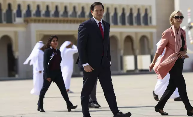 U.S. Secretary of State Marco Rubio walks as he prepares to board an aircraft to depart to the U.S., in Abu Dhabi, United Arab Emirates, Wednesday, Feb. 19, 2025. (Evelyn Hockstein/Pool Photo via AP)