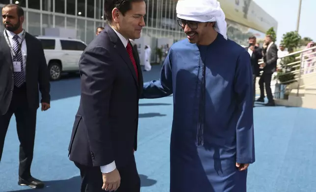 United Arab Emirates Foreign Minister Abdullah bin Zayed Al Nahyan, right, greets U.S. Secretary of State Marco Rubio at ADNEC Centre Abu Dhabi in Abu Dhabi, United Arab Emirates, Wednesday, Feb. 19, 2025. (Evelyn Hockstein/Pool Photo via AP)