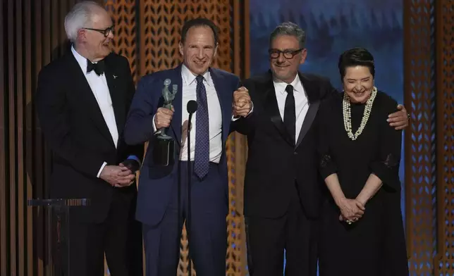 John Lithgow, from left, Ralph Fiennes, Sergio Castellitto, and Isabella Rossellini accepts the award for outstanding performance by a cast in a motion picture for "Conclave" during the 31st annual Screen Actors Guild Awards on Sunday, Feb. 23, 2025, at the Shrine Auditorium in Los Angeles. (AP Photo/Chris Pizzello)