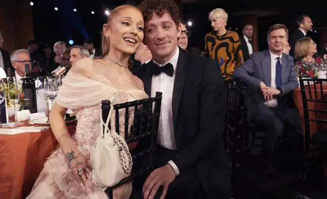 Ariana Grande, left, and Ethan Slater in the audience during the 31st annual Screen Actors Guild Awards on Sunday, Feb. 23, 2025, at the Shrine Auditorium in Los Angeles. (AP Photo/Chris Pizzello)