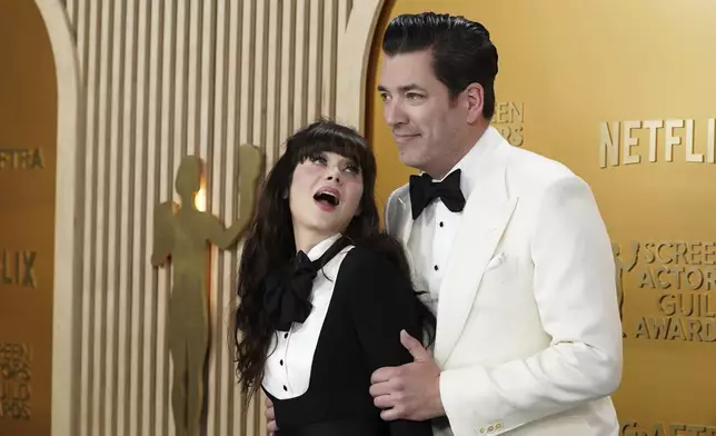 Zooey Deschanel, left, and Jonathan Scott arrive at the 31st annual Screen Actors Guild Awards on Sunday, Feb. 23, 2025, at the Shrine Auditorium in Los Angeles. (Photo by Jordan Strauss/Invision/AP)