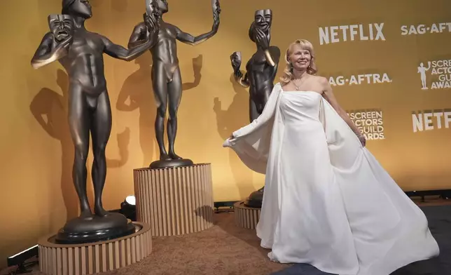 Pamela Anderson arrives at the 31st annual Screen Actors Guild Awards on Sunday, Feb. 23, 2025, at the Shrine Auditorium in Los Angeles. (AP Photo/Chris Pizzello)
