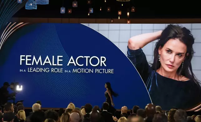 Demi Moore accepts the award for outstanding performance by a female actor in a leading role for "The Substance" during the 31st annual Screen Actors Guild Awards on Sunday, Feb. 23, 2025, at the Shrine Auditorium in Los Angeles. (AP Photo/Chris Pizzello)