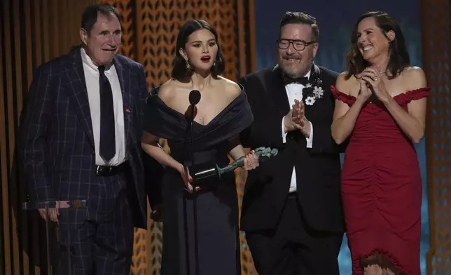 Richard Kind, from left, Selena Gomez, Michael Cyril Creighton, and Molly Shannon accept the award for outstanding performance by an ensemble in a comedy series for "Only Murders In The Building" during the 31st annual Screen Actors Guild Awards on Sunday, Feb. 23, 2025, at the Shrine Auditorium in Los Angeles. (AP Photo/Chris Pizzello)