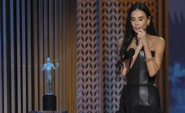 Demi Moore accepts the award for outstanding performance by a female actor in a leading role for "The Substance" during the 31st annual Screen Actors Guild Awards on Sunday, Feb. 23, 2025, at the Shrine Auditorium in Los Angeles. (AP Photo/Chris Pizzello)