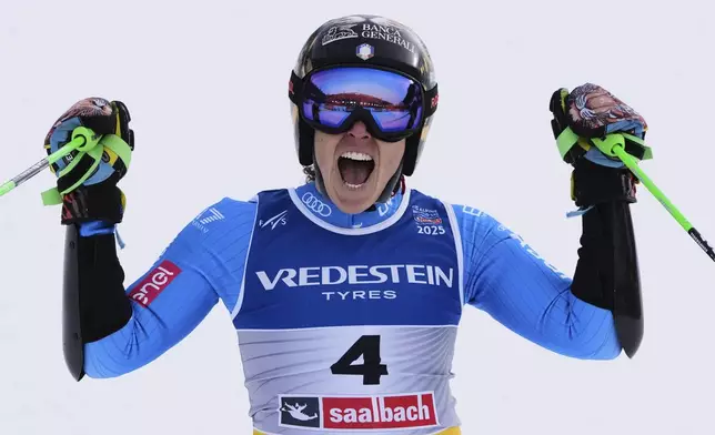 Italy's Federica Brignone celebrates winning the gold medal in a women's giant slalom, at the Alpine Ski World Championships, in Saalbach-Hinterglemm, Austria, Thursday, Feb. 13, 2025. (AP Photo/Giovanni Auletta)