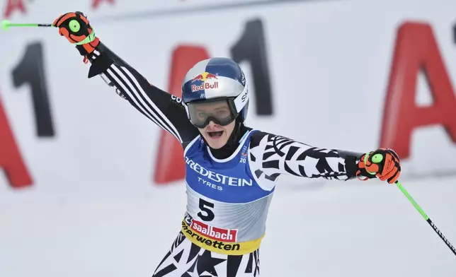 New Zealand's Alice Robinson celebrates at the finish area of a women's giant slalom, at the Alpine Ski World Championships, in Saalbach-Hinterglemm, Austria, Thursday, Feb. 13, 2025. (AP Photo/Marco Trovati)