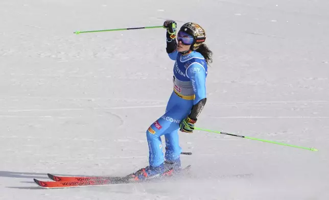 Italy's Federica Brignone celebrates at the finish area of a women's giant slalom, at the Alpine Ski World Championships, in Saalbach-Hinterglemm, Austria, Thursday, Feb. 13, 2025. (AP Photo/Giovanni Auletta)