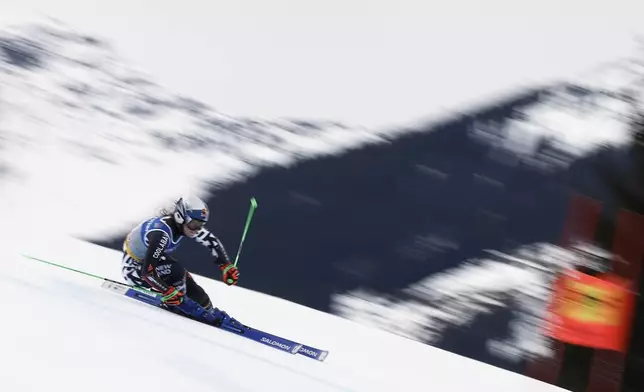 New Zealand's Alice Robinson speeds down the course during a women's giant slalom, at the Alpine Ski World Championships, in Saalbach-Hinterglemm, Austria, Thursday, Feb. 13, 2025. (AP Photo/Gabriele Facciotti