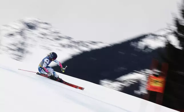 United States' Paula Moltzan speeds down the course during a women's giant slalom, at the Alpine Ski World Championships, in Saalbach-Hinterglemm, Austria, Thursday, Feb. 13, 2025. (AP Photo/Gabriele Facciotti