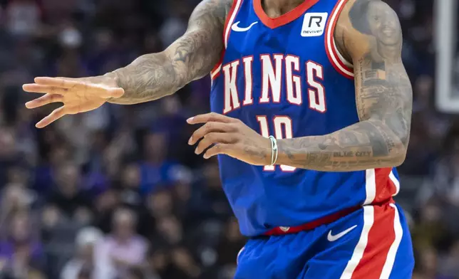 Sacramento Kings forward DeMar DeRozan reacts to no foul called during the first half of an NBA basketball game against the Golden State Warriors, Friday, Feb. 21, 2025, in Sacramento, Calif. (AP Photo/Sara Nevis)