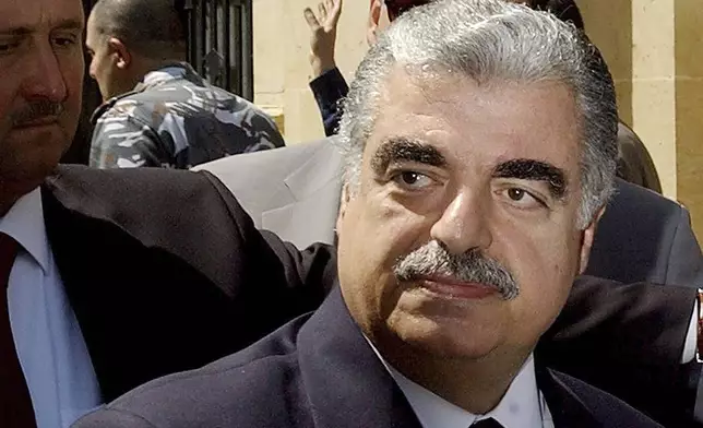FILE - Lebanese Prime Minister-designate Rafik Hariri leaves the Parliament building in Beirut, Lebanon, on April 17, 2003. (AP Photo/File)