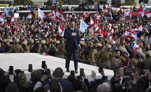 Former Lebanese Prime Minister Saad Hariri greets his supporters after he paid his respects at the grave of his father, former Prime Minister Rafik Hariri, on the 20th anniversary of his assassination in Beirut, Lebanon, Friday, Feb. 14, 2025. (AP Photo/Hassan Ammar)