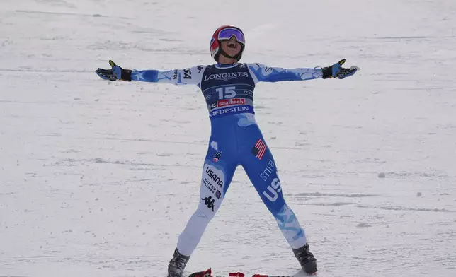 United States' Lauren Macuga celebrates at the finish area of a downhill run of a women's team combined event, at the Alpine Ski World Championships, in Saalbach-Hinterglemm, Austria, Tuesday, Feb. 11, 2025. (AP Photo/Giovanni Auletta)