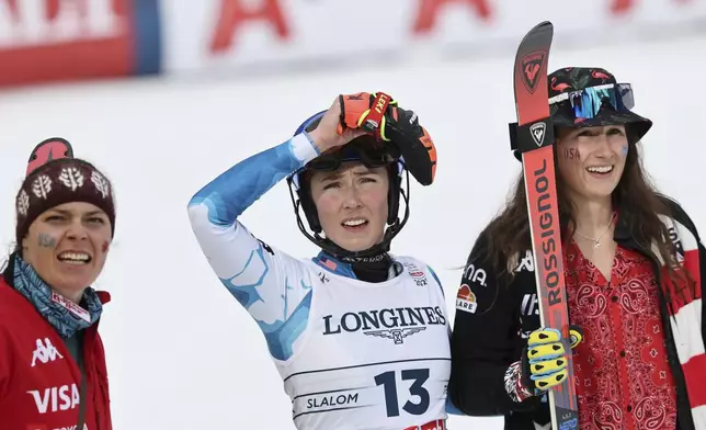 From left, United States' Breezy Johnson, United States' Mikaela Shiffrin and United States' Lauren Macuga at the finish area of a slalom run of a women's team combined event, at the Alpine Ski World Championships, in Saalbach-Hinterglemm, Austria, Tuesday, Feb. 11, 2025. (AP Photo/Marco Trovati)