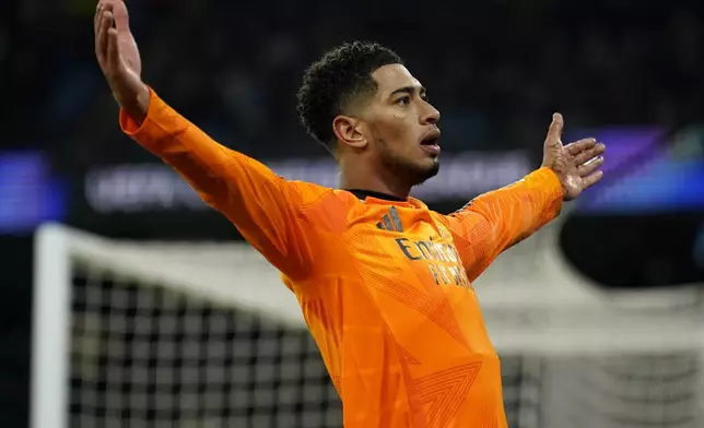 Real Madrid's Jude Bellingham celebrates after scoring his sides third goal during the Champions League playoff first leg soccer match between Manchester City and Real Madrid at the Etihad Stadium in Manchester, England, Tuesday, Feb. 11, 2025. (AP Photo/Dave Thompson)