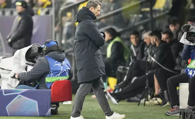 Dortmund's head coach Niko Kovac walks during the Champions League playoff second leg soccer match between Borussia Dortmund and Sporting CP at the Signa-Iduna Park in Dortmund, Germany, Wednesday, Feb. 19, 2025. (AP Photo/Martin Meissner)