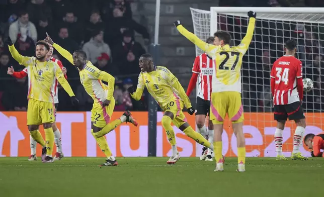 Juventus' Timothy Weah, second left, celebrates after scoring his side's opening goal during the Champions League playoff second leg soccer match between PSV and Juventus at Phillips Stadium in Eindhoven, Netherlands, Wednesday, Feb.19, 2025. (AP Photo/Peter Dejong)