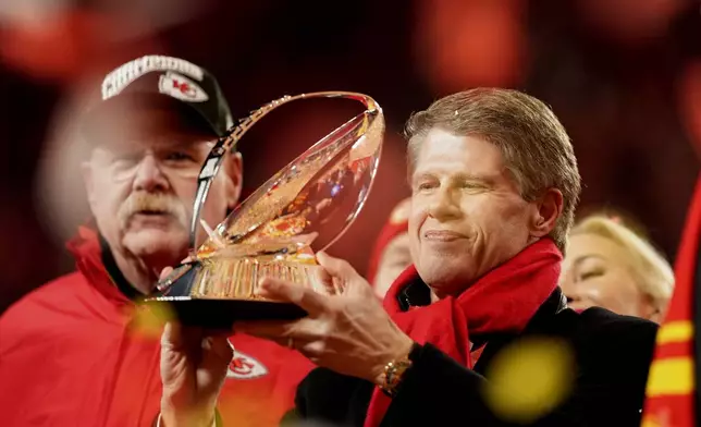 Kansas City Chiefs owner Clark Hunt holds the Lamar Hunt Trophy after the Chiefs defeated the Buffalo Bills in the AFC Championship NFL football game, Sunday, Jan. 26, 2025, in Kansas City, Mo. (AP Photo/Charlie Riedel)
