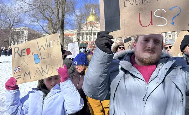 Demonstrators join more than a thousand people protesting the policies of the Trump administration marched from the Boston Common past City Hall to the North End, Monday, Feb. 17, 2025 in Boston. (AP/Michael Casey)