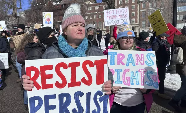 Demonstrators join more than a thousand people protesting the policies of the Trump administration marched from the Boston Common past City Hall to the North End, Monday, Feb. 17, 2025 in Boston. (AP/Michael Casey)