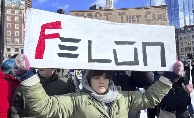 Demonstrators join more than a thousand people protesting the policies of the Trump administration marched from the Boston Common past City Hall to the North End, Monday, Feb. 17, 2025 in Boston. (AP/Michael Casey)