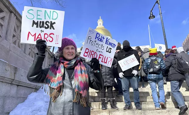 Demonstrators join more than a thousand people protesting the policies of the Trump administration marched from the Boston Common past City Hall to the North End, Monday, Feb. 17, 2025 in Boston. (AP/Michael Casey)