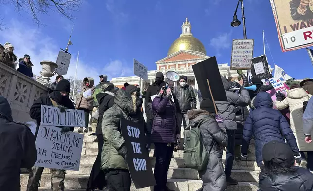 Demonstrators join more than a thousand people protesting the policies of the Trump administration marched from the Boston Common past City Hall to the North End, Monday, Feb. 17, 2025 in Boston. (AP/Michael Casey)