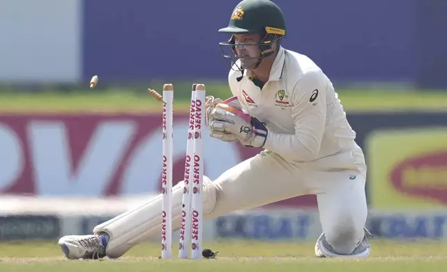Australia's Alex Carey breaks the wicket during day four of the second test cricket match between Sri Lanka and Australia in Galle, Sri Lanka, Sunday, Feb. 9, 2025. (AP Photo/Eranga Jayawardena)