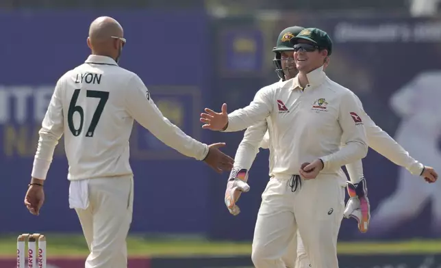 Australia's Nathan Lyon celebrates the wicket of Sri Lanka's Kusal Mendis during day four of the second test cricket match between Sri Lanka and Australia in Galle, Sri Lanka, Sunday, Feb. 9, 2025. (AP Photo/Eranga Jayawardena)