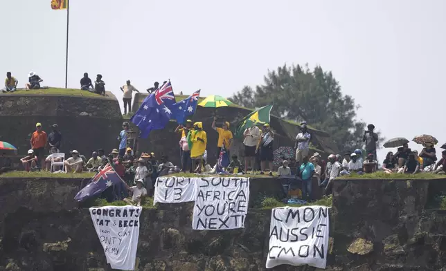 Fans watch the second test cricket match between Sri Lanka and Australia in Galle, Sri Lanka, Sunday, Feb. 9, 2025. (AP Photo/Eranga Jayawardena)