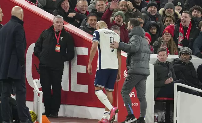 Tottenham's Richarlison leaves the field injured during the English League Cup semifinal second leg soccer match between Liverpool and Tottenham Hotspur at Anfield Stadium in Liverpool, England, Thursday, Feb. 6, 2025. (AP Photo/Jon Super)