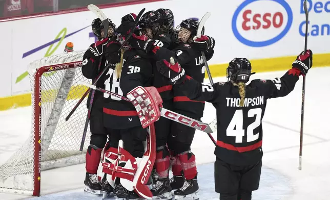 Canada players celebrate after their victory over the United States in the final game of a Rivalry Series in Summerside, Prince Edward Island, Canada, Saturday, Feb. 8, 2025. (Darren Calabrese/The Canadian Press via AP)