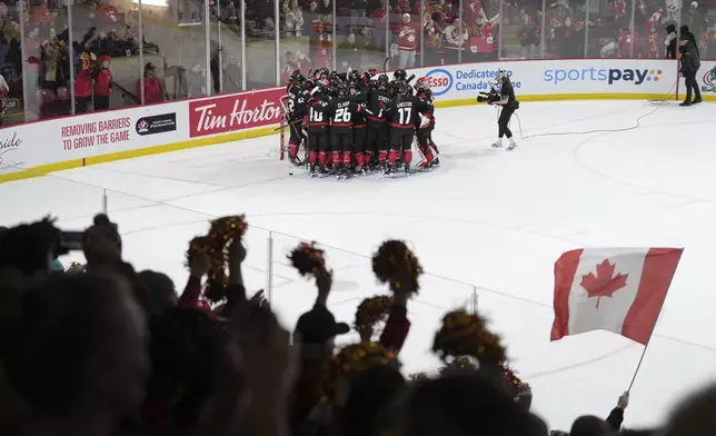 Canada players celebrate after their victory over the United States in the final game of a Rivalry Series in Summerside, Prince Edward Island, Canada, Saturday, Feb. 8, 2025. (Darren Calabrese/The Canadian Press via AP)