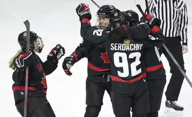 Members of Team Canada celebrate a goal against the United States during the second period of a Rivalry Series hockey game in Summerside, Prince Edward Island, Canada, Saturday, Feb. 8, 2025. (Darren Calabrese/The Canadian Press via AP)