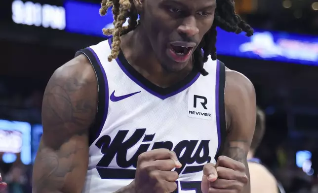 Sacramento Kings guard Keon Ellis reacts to a foul for the Utah Jazz during the second half of an NBA basketball game, Wednesday, Feb. 26, 2025, in Salt Lake City. (AP Photo/Rob Gray)