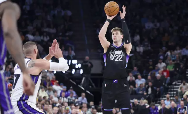 Utah Jazz forward Kyle Filipowski makes a 3-point shot against the Sacramento Kings during the second half of an NBA basketball game, Wednesday, Feb. 26, 2025, in Salt Lake City. (AP Photo/Rob Gray)