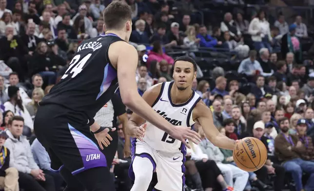 Sacramento Kings forward Keegan Murray (13) passes the ball as Utah Jazz center Walker Kessler (24) defends during the first half of an NBA basketball game, Wednesday, Feb. 26, 2025, in Salt Lake City. (AP Photo/Rob Gray)