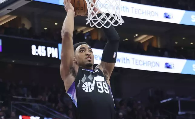 Utah Jazz forward KJ Martin dunks against the Sacramento Kings during the second half of an NBA basketball game, Wednesday, Feb. 26, 2025, in Salt Lake City. (AP Photo/Rob Gray)